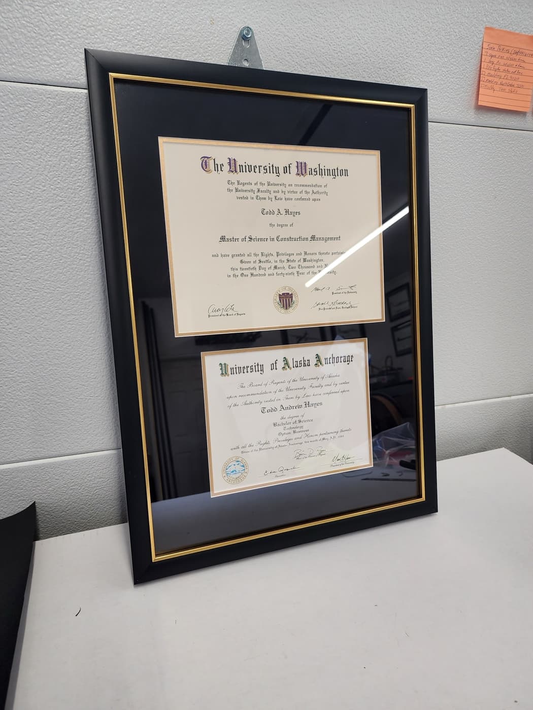 University of Washington diploma double-matted in black with a gold frame by Redhawk Framing Studio in Vancouver, WA