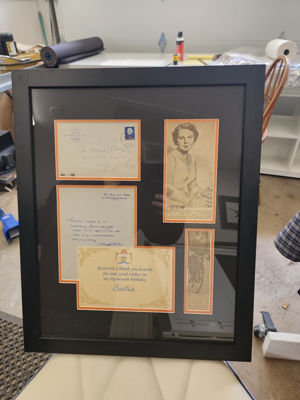 Heritage shadow box preserving vintage letters, a portrait, and keepsakes, custom framed by Redhawk Framing Studio