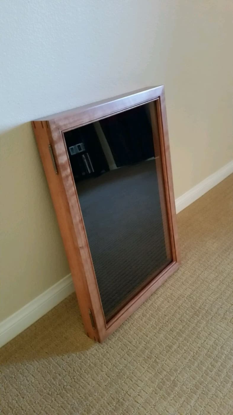 Custom mirror framed in a cherry moulding with a cognac semi-gloss finish by Redhawk Framing Studio