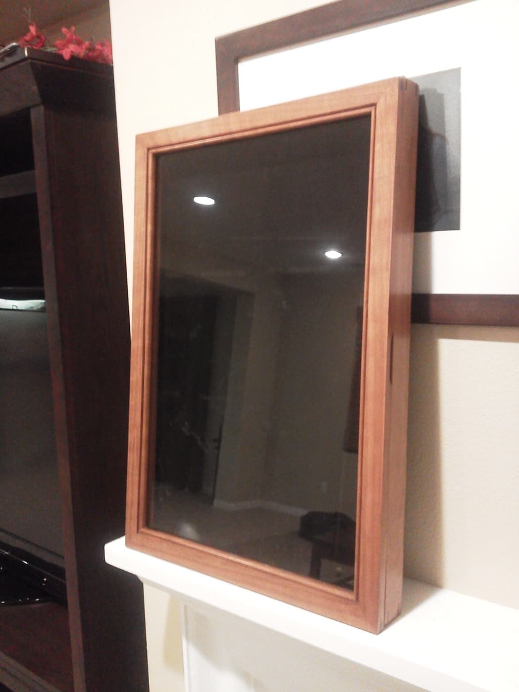 Custom mirror framed in a solid walnut moulding, made to measure by Redhawk Framing Studio in Vancouver, WA