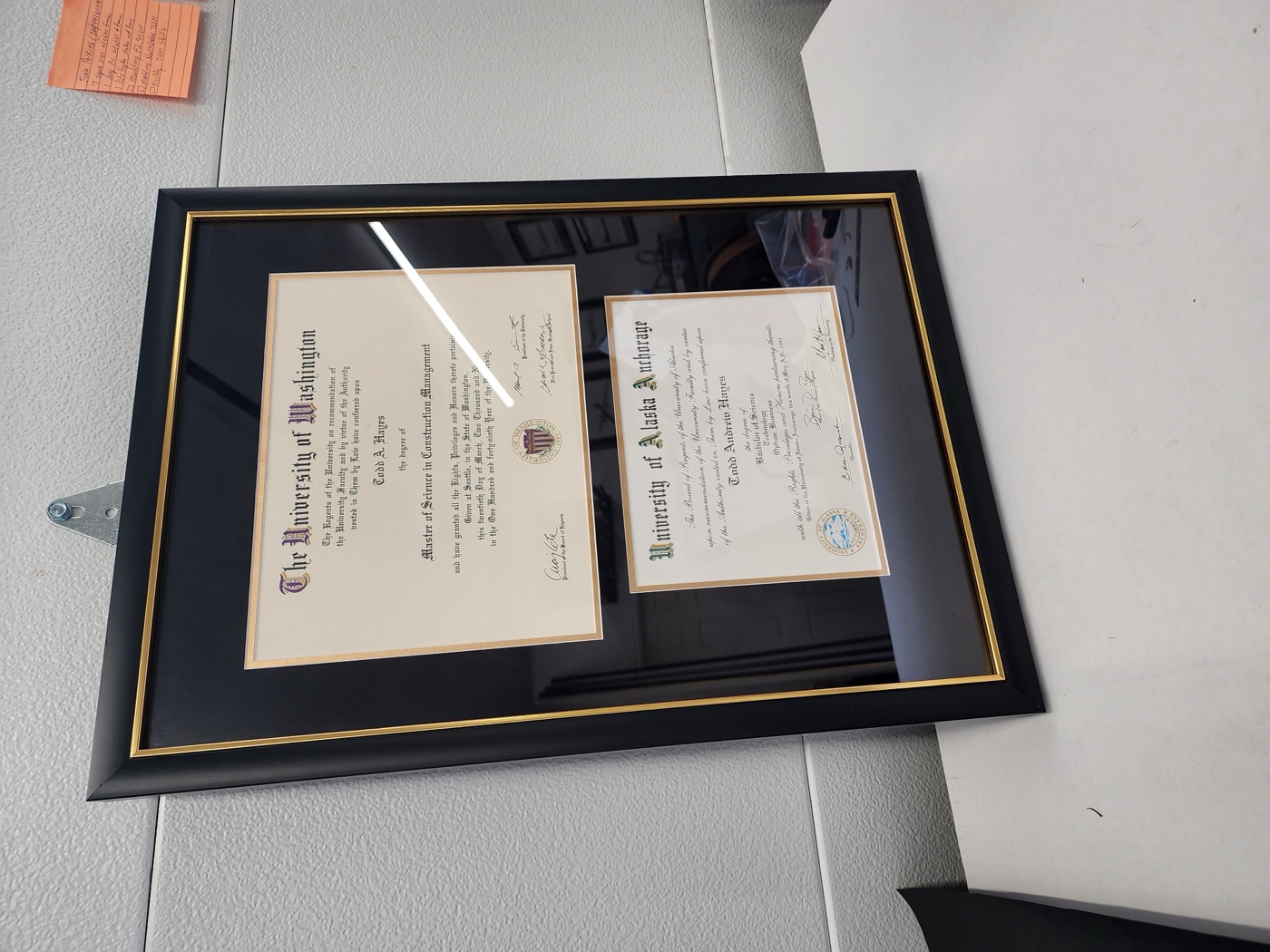 University of Washington diploma double-matted in black with a gold frame by Redhawk Framing Studio in Vancouver, WA